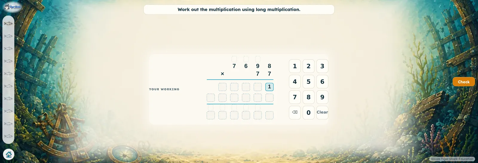 A long multiplication laid out in a grid with a number pad beside it